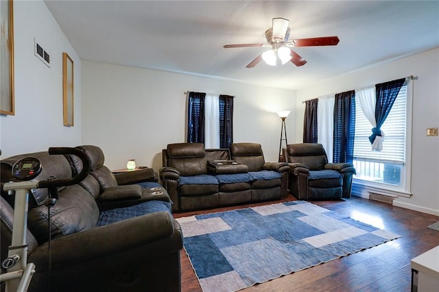 822 S Noland Rd, Independence, MO 64050 - living area with ceiling fan, dark wood-style floors, and baseboards