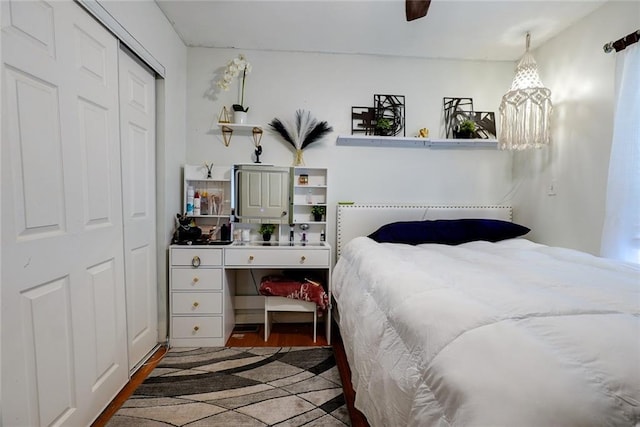 822 S Noland Rd, Independence, MO 64050 - bedroom featuring a closet, ceiling fan, and wood finished floors