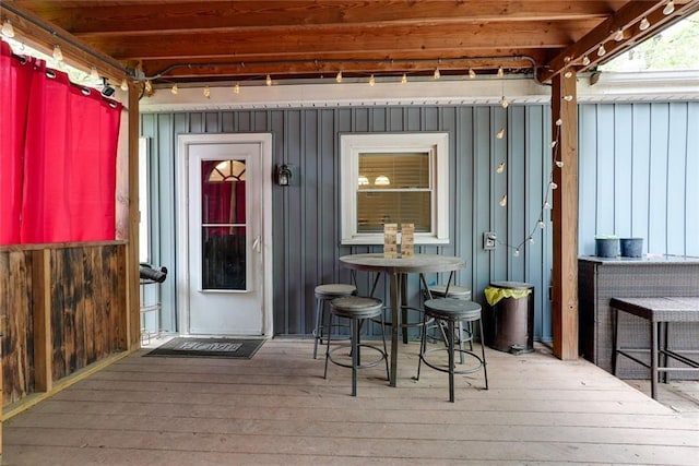 822 S Noland Rd, Independence, MO 64050 - entrance to property featuring board and batten siding and a wooden deck
