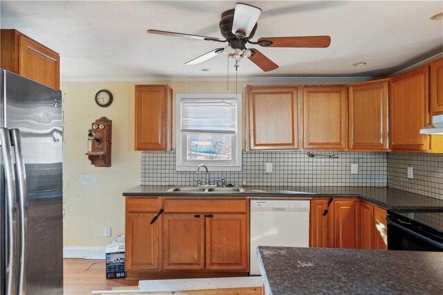 605 N Ardinger St, Hamilton, MO 64644 - kitchen with stainless steel fridge, a sink, white dishwasher, ceiling fan, and ornamental molding