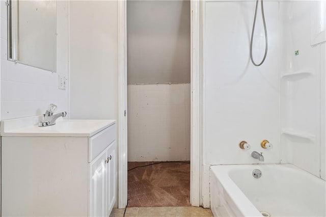 605 N Ardinger St, Hamilton, MO 64644 - bathroom with vanity, tile walls, and tub / shower combination