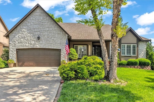 8506 W 155th Pl, Overland Park, KS 66223 - view of front of property with stone siding, a garage, a front lawn, driveway, and a shingled roof