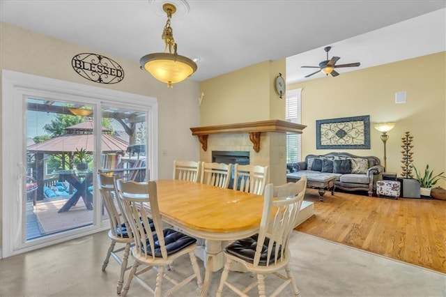 8506 W 155th Pl, Overland Park, KS 66223 - dining room featuring ceiling fan and a fireplace