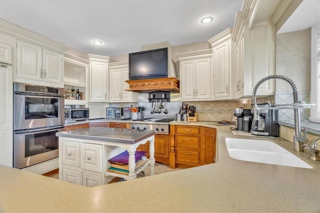 8506 W 155th Pl, Overland Park, KS 66223 - kitchen featuring appliances with stainless steel finishes, a sink, open shelves, tasteful backsplash, and white cabinetry
