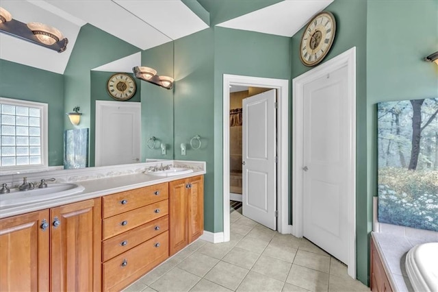 8506 W 155th Pl, Overland Park, KS 66223 - full bath with double vanity, tile patterned flooring, a tub, and lofted ceiling