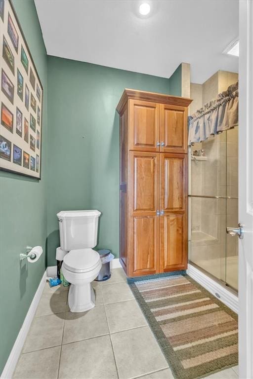 8506 W 155th Pl, Overland Park, KS 66223 - full bathroom featuring toilet, a shower stall, baseboards, and tile patterned floors