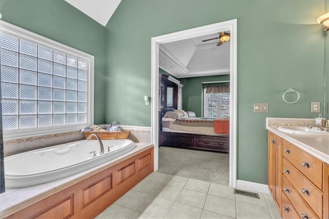 8506 W 155th Pl, Overland Park, KS 66223 - ensuite bathroom with vanity, a garden tub, tile patterned floors, a ceiling fan, and vaulted ceiling