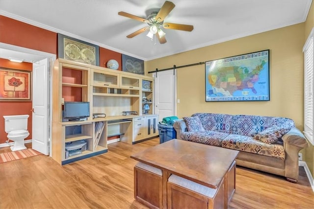 8506 W 155th Pl, Overland Park, KS 66223 - living room featuring a barn door, crown molding, light wood finished floors, and a ceiling fan
