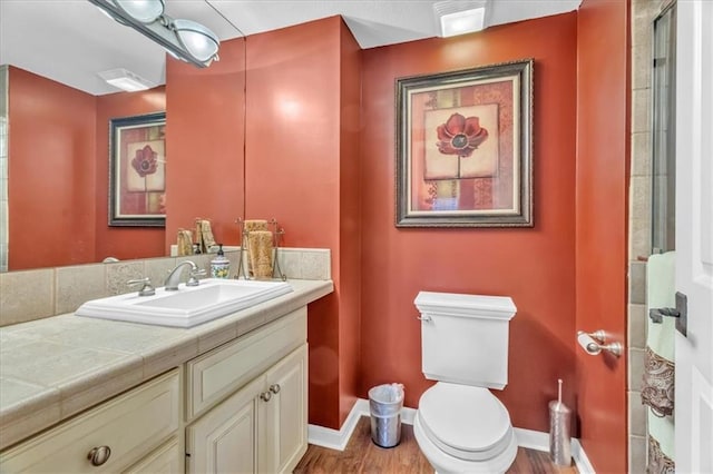 8506 W 155th Pl, Overland Park, KS 66223 - full bathroom with vanity, baseboards, toilet, and wood finished floors