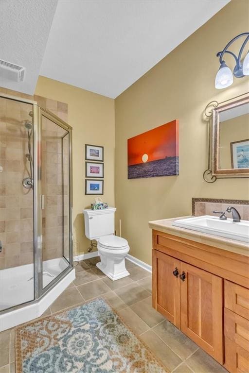 8506 W 155th Pl, Overland Park, KS 66223 - full bath with vanity, toilet, baseboards, a stall shower, and tile patterned flooring
