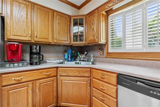 5201 Noland Rd, Kansas City, MO 64133 - kitchen featuring dishwasher, light countertops, ornamental molding, glass insert cabinets, and brown cabinetry