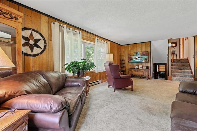 5201 Noland Rd, Kansas City, MO 64133 - living room with wooden walls, carpet floors, a textured ceiling, stairway, and baseboard heating