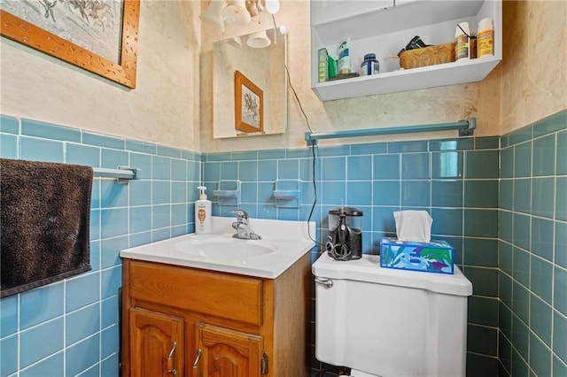 5201 Noland Rd, Kansas City, MO 64133 - half bath featuring tile walls and vanity