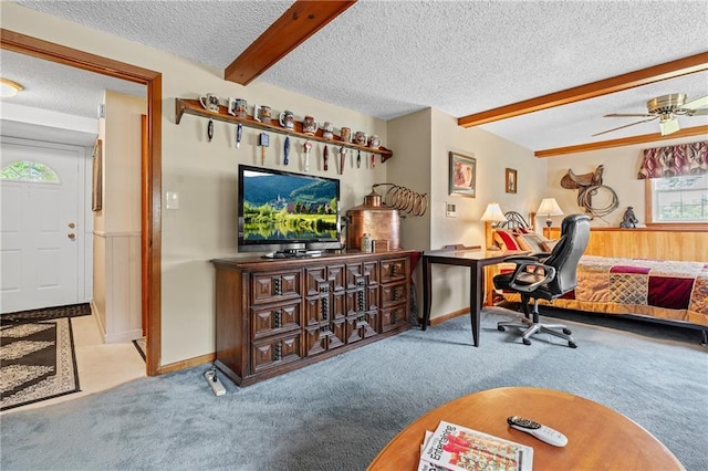 5201 Noland Rd, Kansas City, MO 64133 - home office with a textured ceiling, carpet, beamed ceiling, and ceiling fan