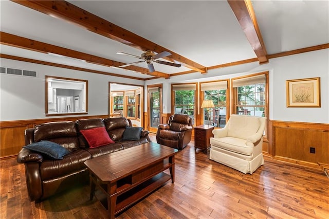 16362 W Briarwood Ct, Olathe, KS 66062 - living room with a wainscoted wall, beam ceiling, a ceiling fan, wooden walls, and wood-type flooring
