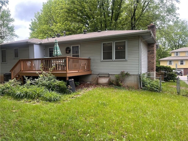 2501 N 73rd Ter, Kansas City, KS 66109 - rear view of property featuring a wooden deck and a chimney