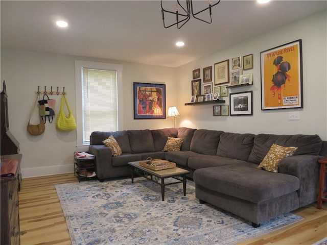 205 W Wea St, Paola, KS 66071 - living area featuring a chandelier, wood finished floors, and recessed lighting