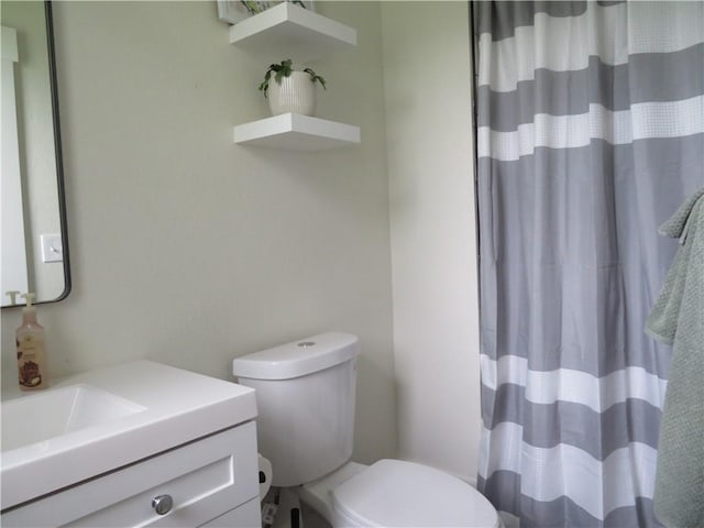 205 W Wea St, Paola, KS 66071 - bathroom featuring vanity and a shower with curtain