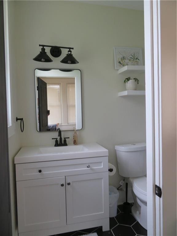 205 W Wea St, Paola, KS 66071 - half bath with vanity and tile patterned flooring