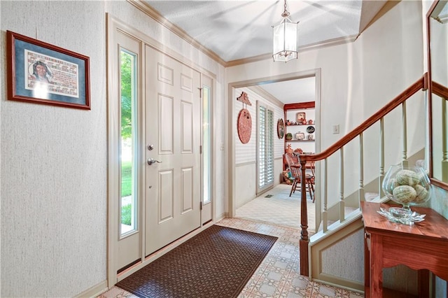 11814 W 149th St, Olathe, KS 66062 - foyer entrance featuring healthy amount of natural light, crown molding, stairs, a chandelier, and a textured wall