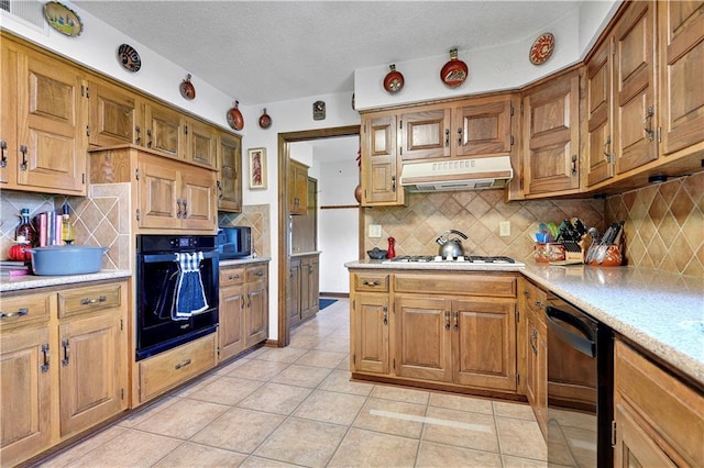 11814 W 149th St, Olathe, KS 66062 - kitchen with black appliances, under cabinet range hood, light countertops, decorative backsplash, and a textured ceiling