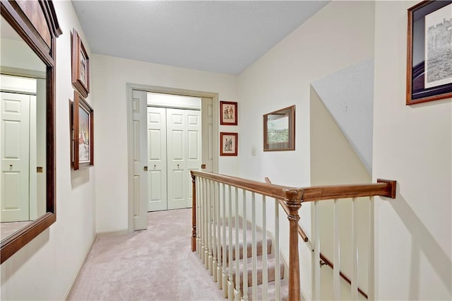 11814 W 149th St, Olathe, KS 66062 - hallway with an upstairs landing and light carpet