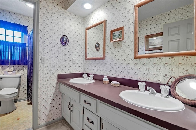 11814 W 149th St, Olathe, KS 66062 - bathroom featuring double vanity and wallpapered walls
