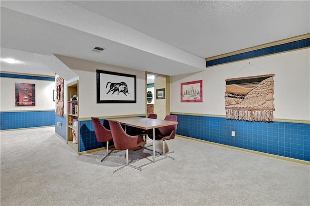 11814 W 149th St, Olathe, KS 66062 - carpeted dining room with a wainscoted wall and a textured ceiling