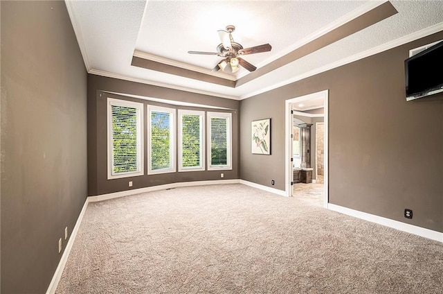 4512 NE Parks Summit Ter, Lees Summit, MO 64064 - empty room with carpet floors, crown molding, a ceiling fan, a raised ceiling, and a textured ceiling