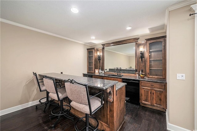 4512 NE Parks Summit Ter, Lees Summit, MO 64064 - indoor wet bar featuring dishwasher, dark wood-style flooring, recessed lighting, and crown molding
