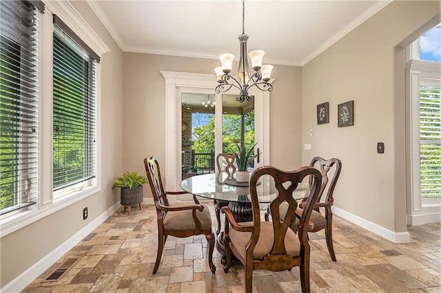 4512 NE Parks Summit Ter, Lees Summit, MO 64064 - dining area featuring stone tile floors, a chandelier, healthy amount of natural light, and crown molding