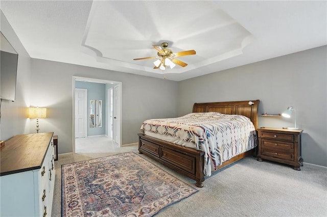 3632 NW Blue Jacket Dr, Lees Summit, MO 64064 - bedroom with light colored carpet, a raised ceiling, baseboards, and a ceiling fan