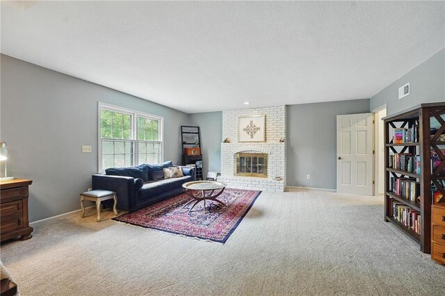 3632 NW Blue Jacket Dr, Lees Summit, MO 64064 - carpeted living area featuring baseboards, a fireplace, and a textured ceiling