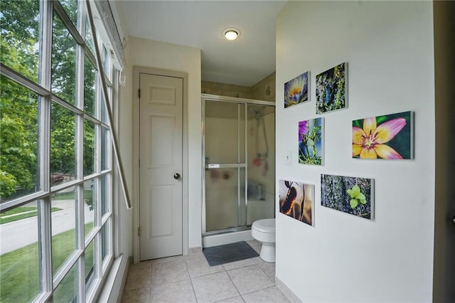 3632 NW Blue Jacket Dr, Lees Summit, MO 64064 - full bath featuring a stall shower, toilet, and tile patterned floors