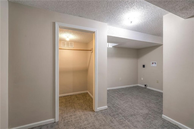5917 W 101st Ter, Overland Park, KS 66207 - interior space featuring hookup for a washing machine, a textured ceiling, and carpet floors