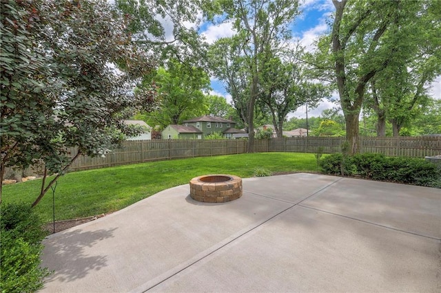 5917 W 101st Ter, Overland Park, KS 66207 - fenced backyard featuring an outdoor fire pit and a patio