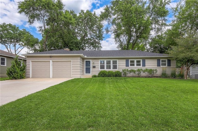 5917 W 101st Ter, Overland Park, KS 66207 - ranch-style home with an attached garage, driveway, and a front lawn