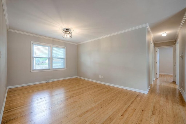 5917 W 101st Ter, Overland Park, KS 66207 - empty room featuring light wood-type flooring and ornamental molding