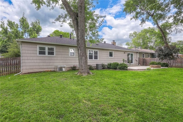 5917 W 101st Ter, Overland Park, KS 66207 - rear view of property featuring a patio and a chimney