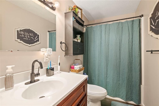 302 W 4th St, Waverly, KS 66871 - bathroom with vanity, a textured ceiling, and toilet