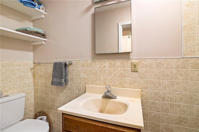 302 W 4th St, Waverly, KS 66871 - bathroom featuring vanity, tile walls, toilet, and a wainscoted wall