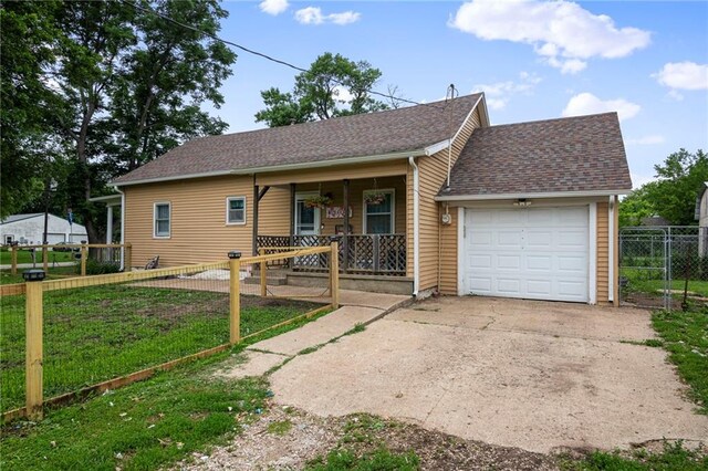302 W 4th St, Waverly, KS 66871 - ranch-style home with covered porch, an attached garage, a shingled roof, and concrete driveway