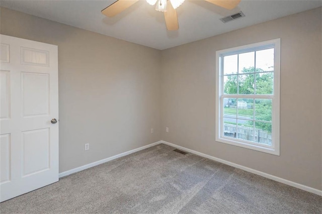 7503 N Lewis Ave, Kansas City, MO 64158 - spare room featuring carpet flooring and a ceiling fan