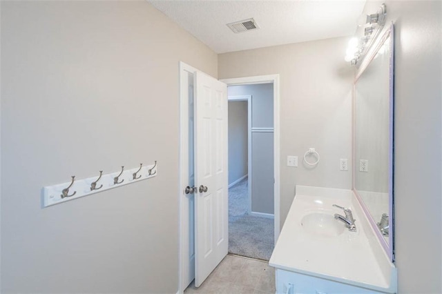 7503 N Lewis Ave, Kansas City, MO 64158 - bathroom with vanity and tile patterned floors