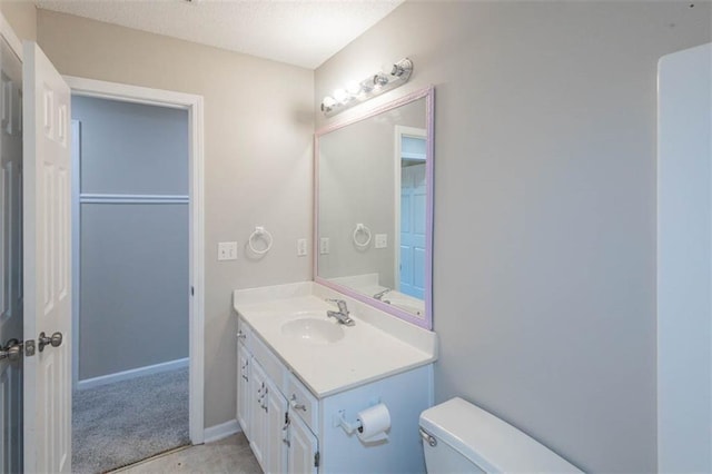 7503 N Lewis Ave, Kansas City, MO 64158 - bathroom with vanity and a textured ceiling