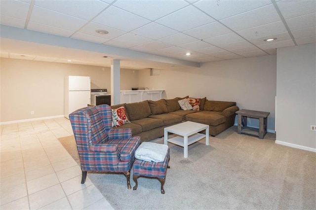 7503 N Lewis Ave, Kansas City, MO 64158 - living area with recessed lighting, a paneled ceiling, and light tile patterned floors