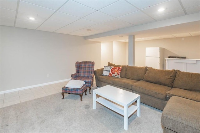 7503 N Lewis Ave, Kansas City, MO 64158 - living area with carpet, tile patterned flooring, recessed lighting, and a paneled ceiling