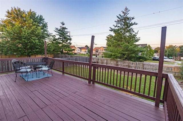 7503 N Lewis Ave, Kansas City, MO 64158 - wooden terrace featuring a fenced backyard and outdoor dining space