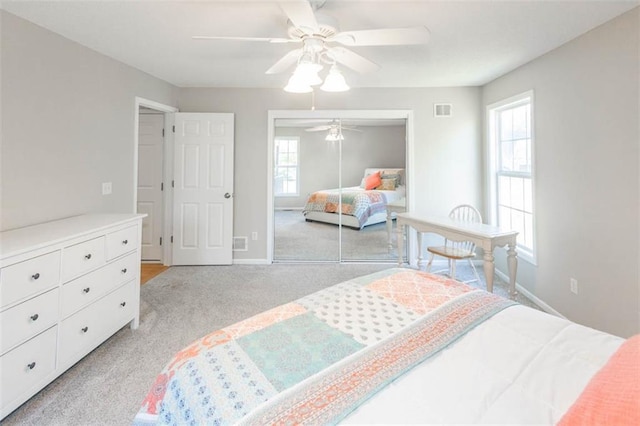 7503 N Lewis Ave, Kansas City, MO 64158 - bedroom featuring light carpet, a closet, and a ceiling fan