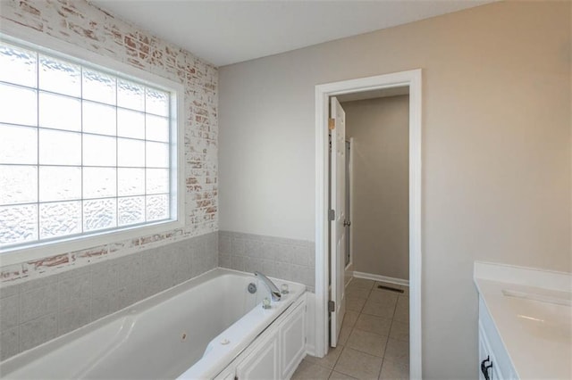 7503 N Lewis Ave, Kansas City, MO 64158 - bathroom with tile patterned floors, healthy amount of natural light, a jetted tub, and vanity